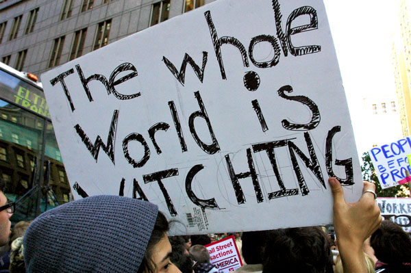OWS_19_Whole_World_is_Watching.jpg